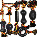 6-teiliges Hundespielzeug-Set mit schwarzen Gummiformen und geflochtenen Seilen in Gelb, Rot und Schwarz.