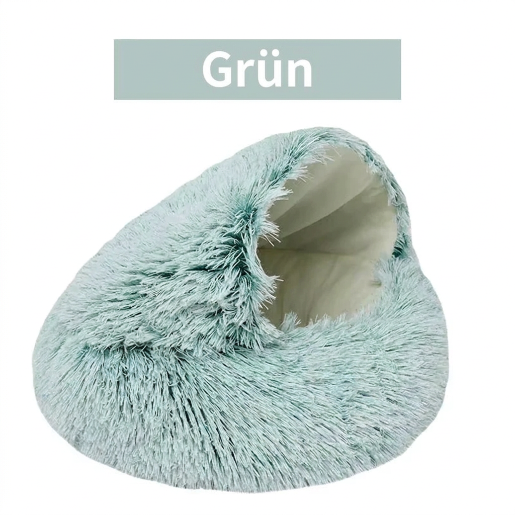 Grüne Plüsch-Katzenhöhle mit rundem Rand und heller Innenpolsterung.