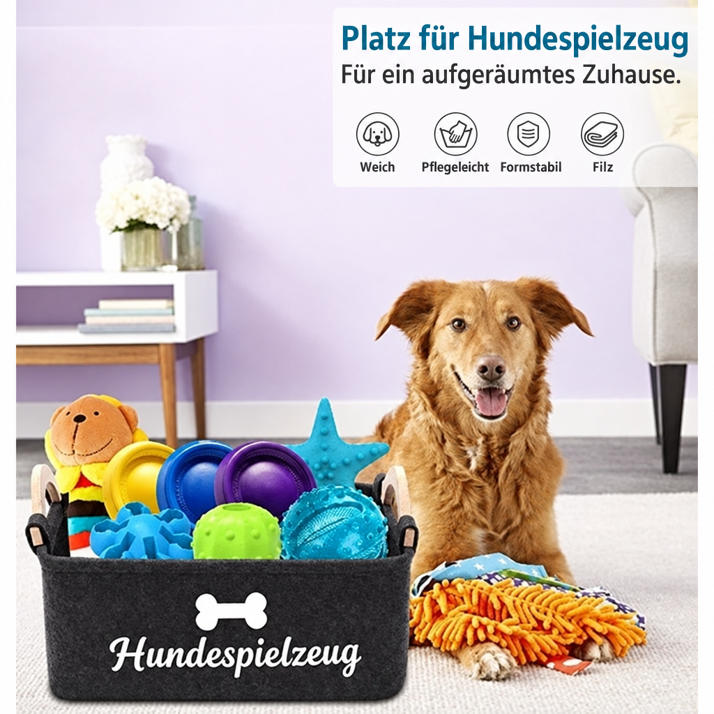 Brauner Hund sitzt neben einem mit Spielzeug gefüllten Filzkorb mit der Aufschrift «Hundespielzeug»